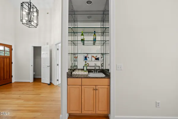 a kitchen with stainless steel appliances granite countertop a sink and cabinets