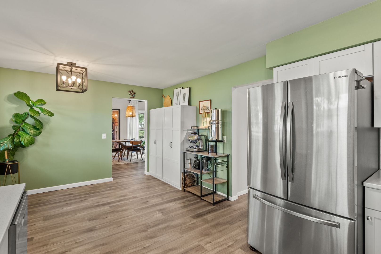 1435 26th Avenue Moline, IL 61265 - Photo 9 of 38 a view of a kitchen with refrigerator and wooden floor