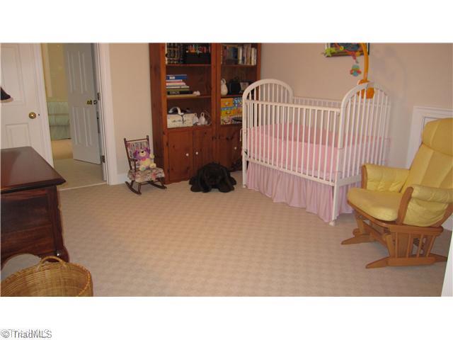 5702 Wolf Ridge Court Oak Ridge, NC 27310 - Photo 13 of 16 3rd Bedroom. This bedroom is just off bath and has a little niche that can be used for childs playarea