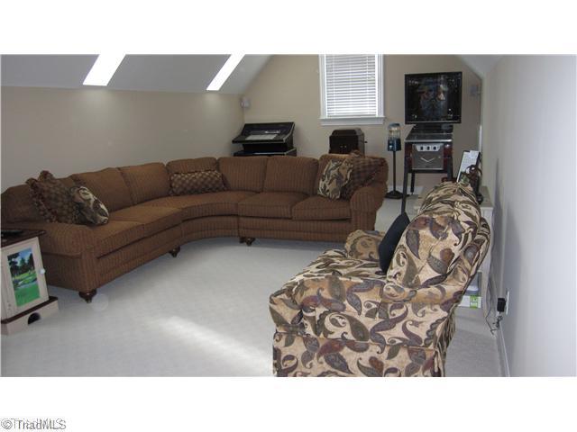 5702 Wolf Ridge Court Oak Ridge, NC 27310 - Photo 14 of 16 Bonus. Bonus room has surround sound and plenty of room for playroom for children.