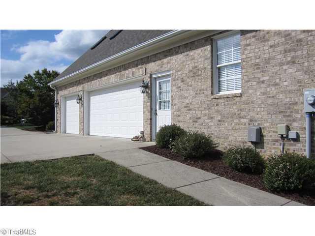 5702 Wolf Ridge Court Oak Ridge, NC 27310 - Photo 15 of 16 Exterior Front. Three car Garage allows for plenty of storage space.