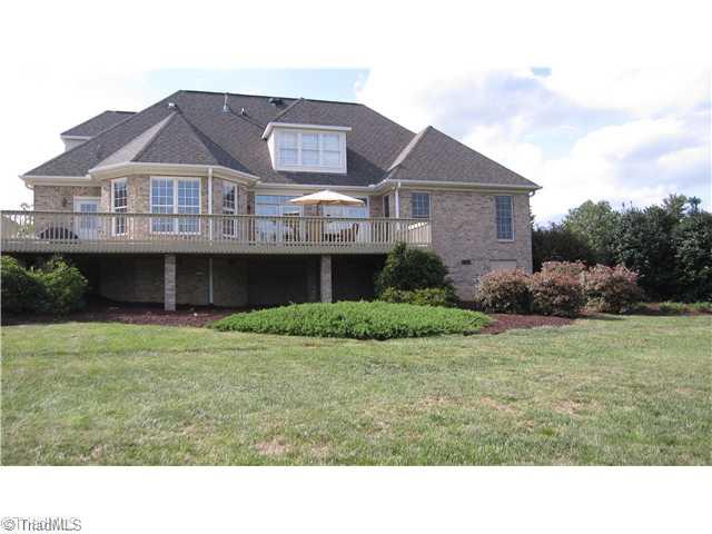 5702 Wolf Ridge Court Oak Ridge, NC 27310 - Photo 16 of 16 Exterior Front. Home sits on 1.70 Acres with county taxes and no HOA