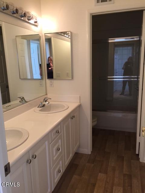 1673 Paseo Castille Camarillo, CA 93010 - Photo 14 of 20 a bathroom with a sink a toilet and mirror