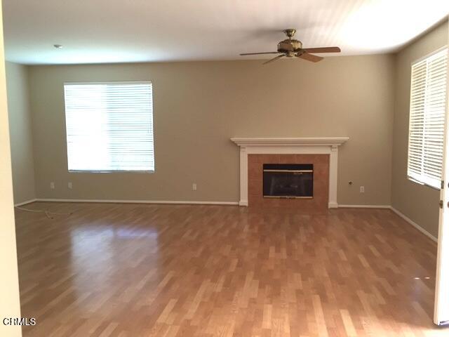 1673 Paseo Castille Camarillo, CA 93010 - Photo 6 of 20 an empty room with windows and fireplace