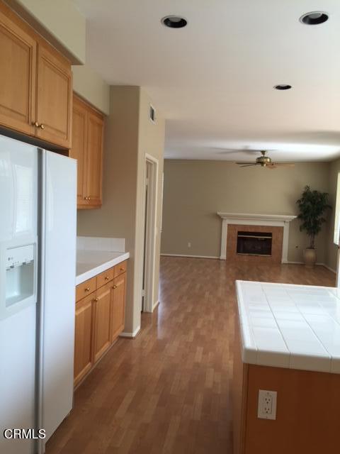 1673 Paseo Castille Camarillo, CA 93010 - Photo 7 of 20 a kitchen with stainless steel appliances a refrigerator and a stove