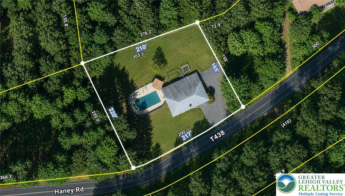 135 Haney Road Kunkletown, PA 18058 - Photo 53 of 53 This aerial view showcases a residence with a private pool, surrounded by lush natural landscaping.