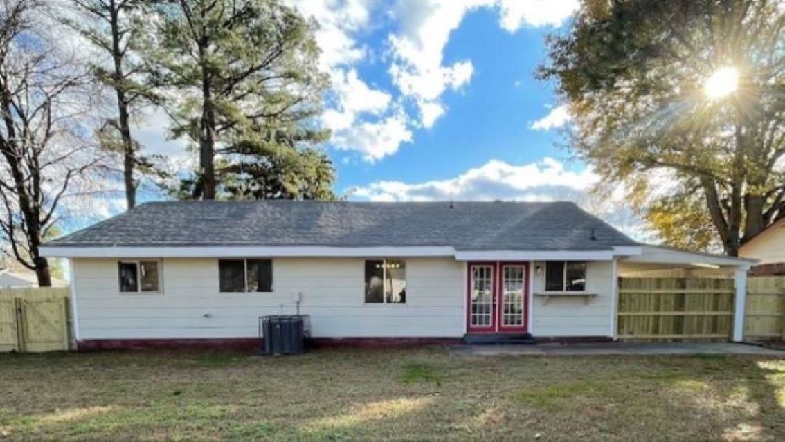 4704 Bill Knight Road Millington, TN 38053 - Photo 15 of 17 Back of house with central AC unit and a lawn