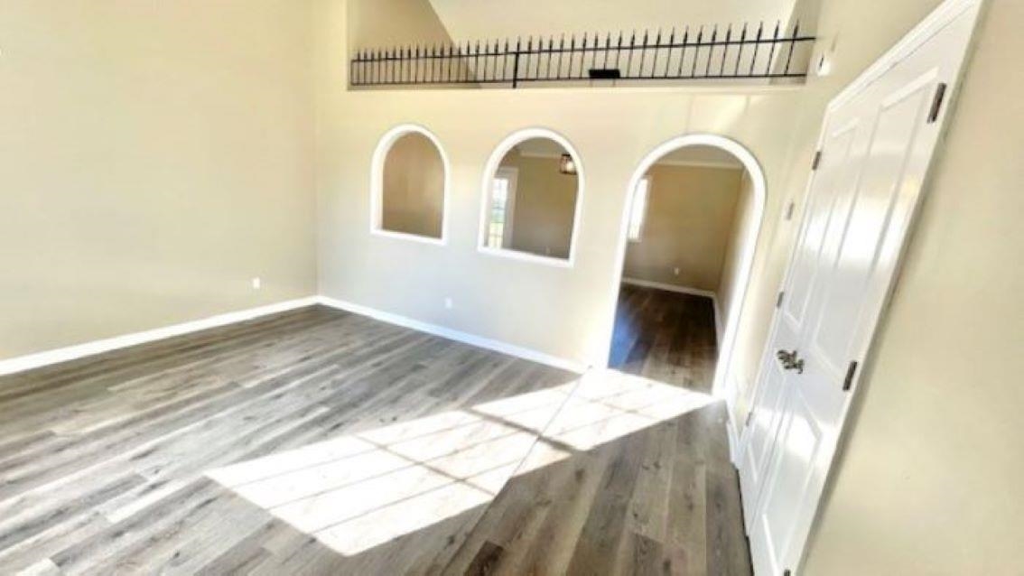 4704 Bill Knight Road Millington, TN 38053 - Photo 2 of 17 Empty room featuring wood-type flooring