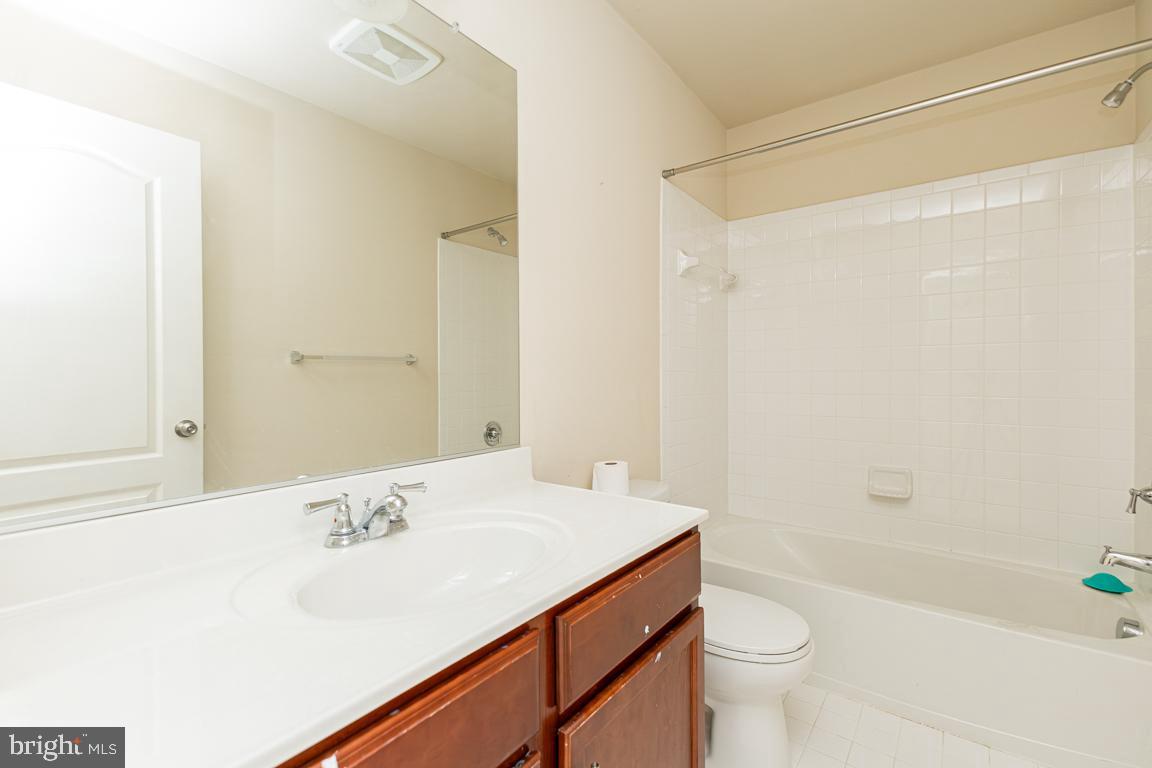 4511 Potomac Highlands Circle Triangle, VA 22172 - Photo 13 of 31 a bathroom with a sink a toilet and shower