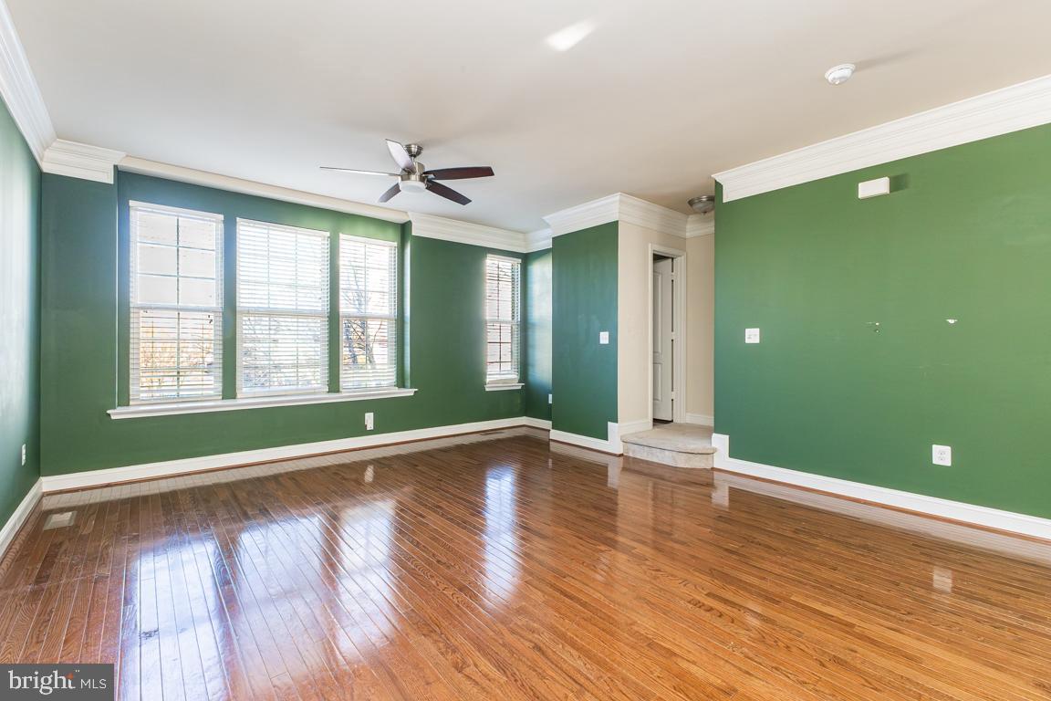 4511 Potomac Highlands Circle Triangle, VA 22172 - Photo 18 of 31 an empty room with wooden floor and windows