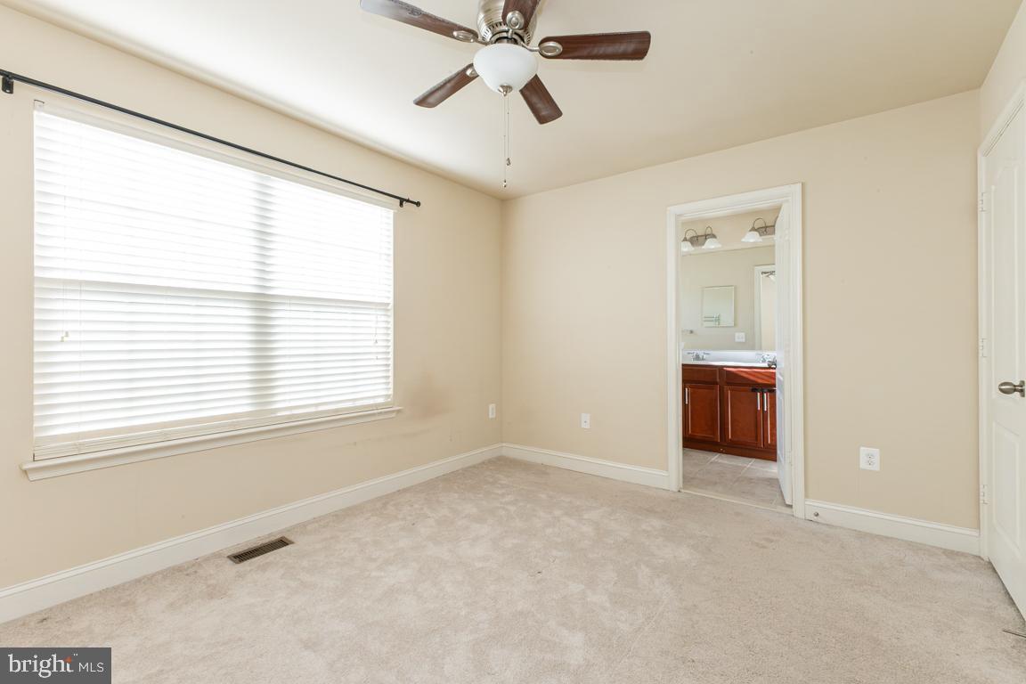 4511 Potomac Highlands Circle Triangle, VA 22172 - Photo 21 of 31 a view of an empty room with a window