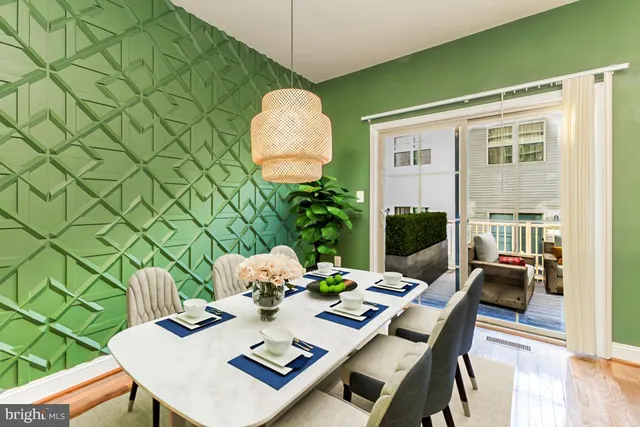 a view of a dining room and livingroom with furniture