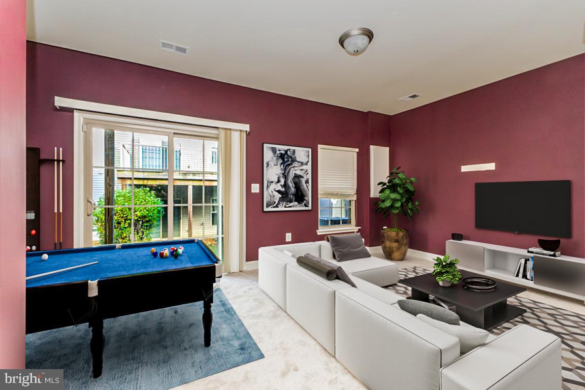 4511 Potomac Highlands Circle Triangle, VA 22172 - Photo 7 of 31 a living room with furniture and a potted plant