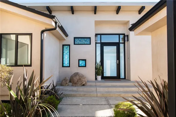 a front view of a house with a entryway