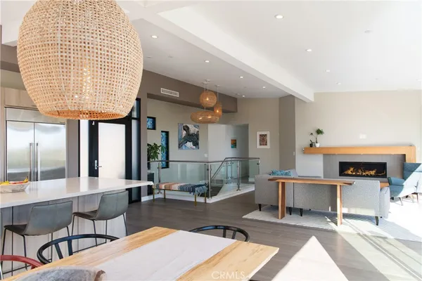 a living room with furniture a fireplace and a table