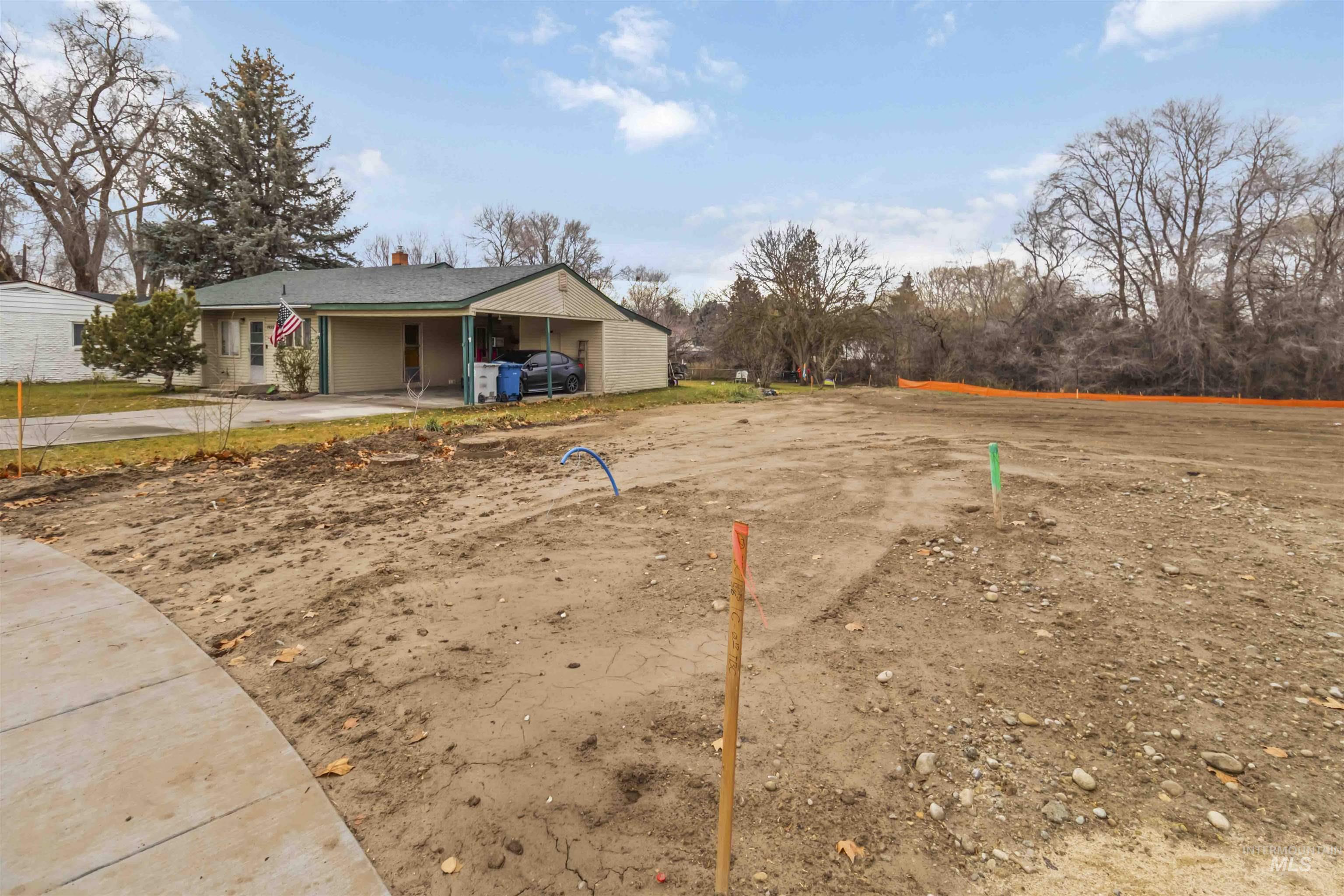 Oregon Avenue Caldwell, ID 83605 - Photo 18 of 42 View of property's community featuring an attached carport and driveway