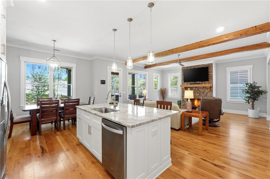 206 Trecastle Square Canton, GA 30114 - Photo 13 of 49 a living room with stainless steel appliances granite countertop furniture wooden floor and a view of kitchen