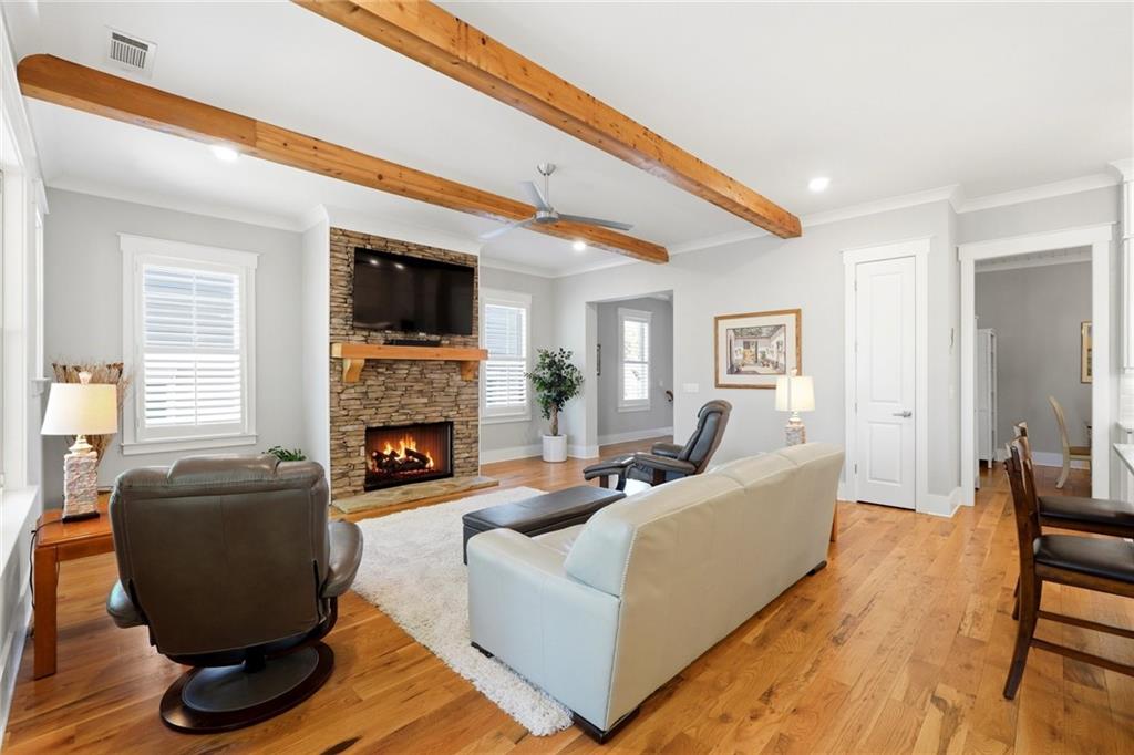 206 Trecastle Square Canton, GA 30114 - Photo 14 of 49 a living room with furniture a flat screen tv and a fireplace