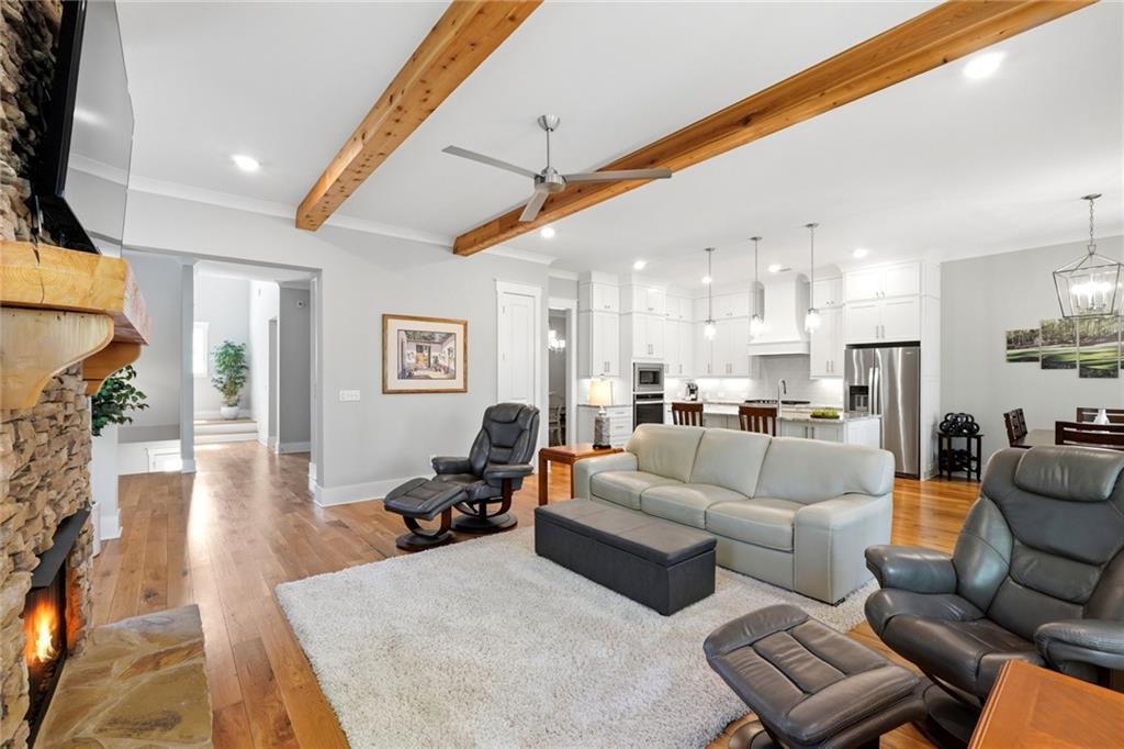 206 Trecastle Square Canton, GA 30114 - Photo 15 of 49 a living room with furniture kitchen view and a large window