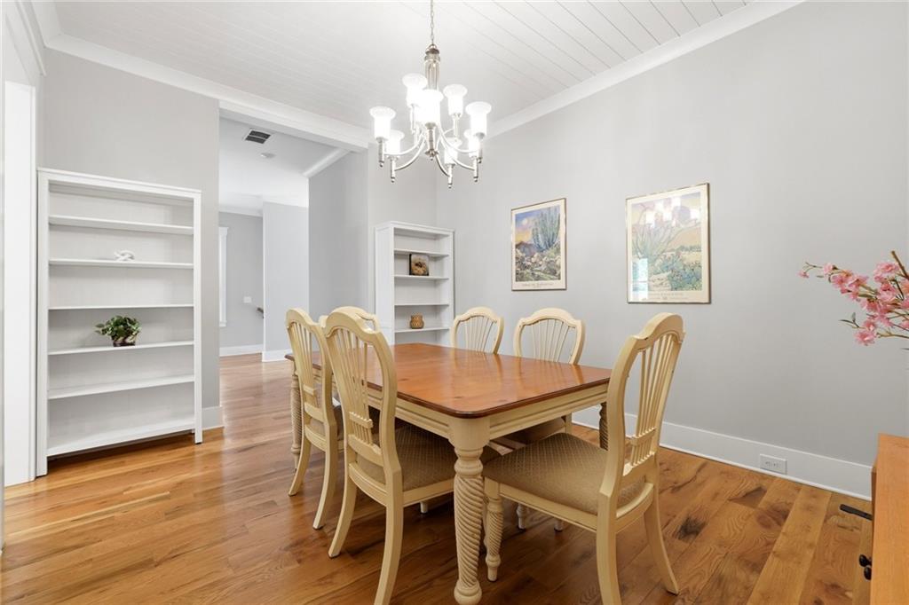 206 Trecastle Square Canton, GA 30114 - Photo 17 of 49 a view of a dining room with furniture and wooden floor