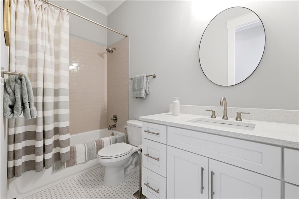 206 Trecastle Square Canton, GA 30114 - Photo 20 of 49 a bathroom with a toilet a sink and a mirror