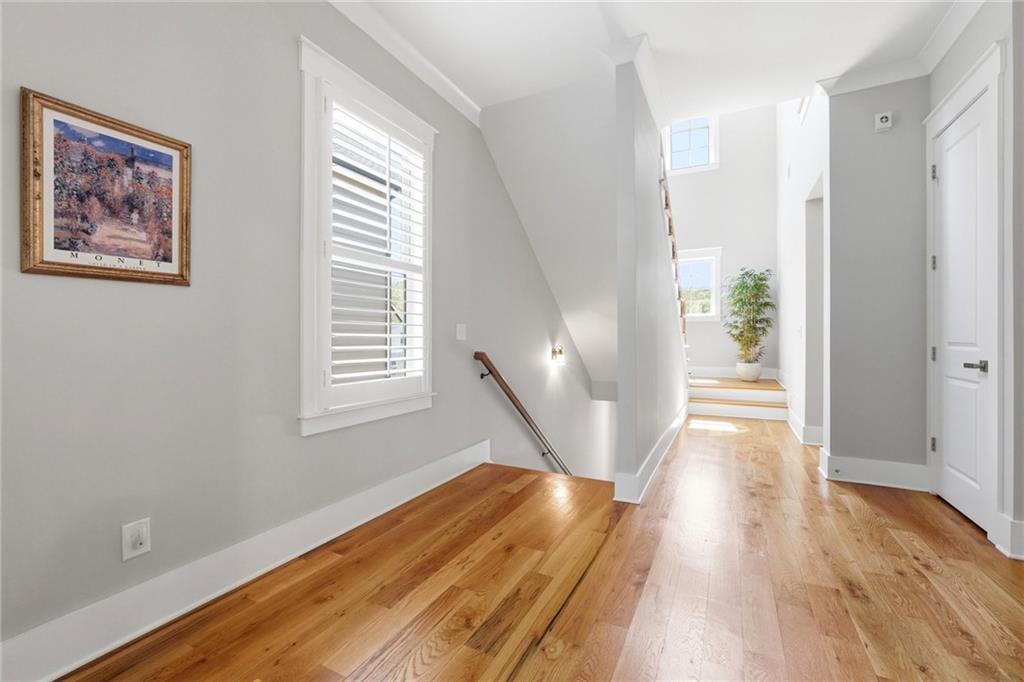 206 Trecastle Square Canton, GA 30114 - Photo 21 of 49 a view of a hallway with wooden floor and a bathroom