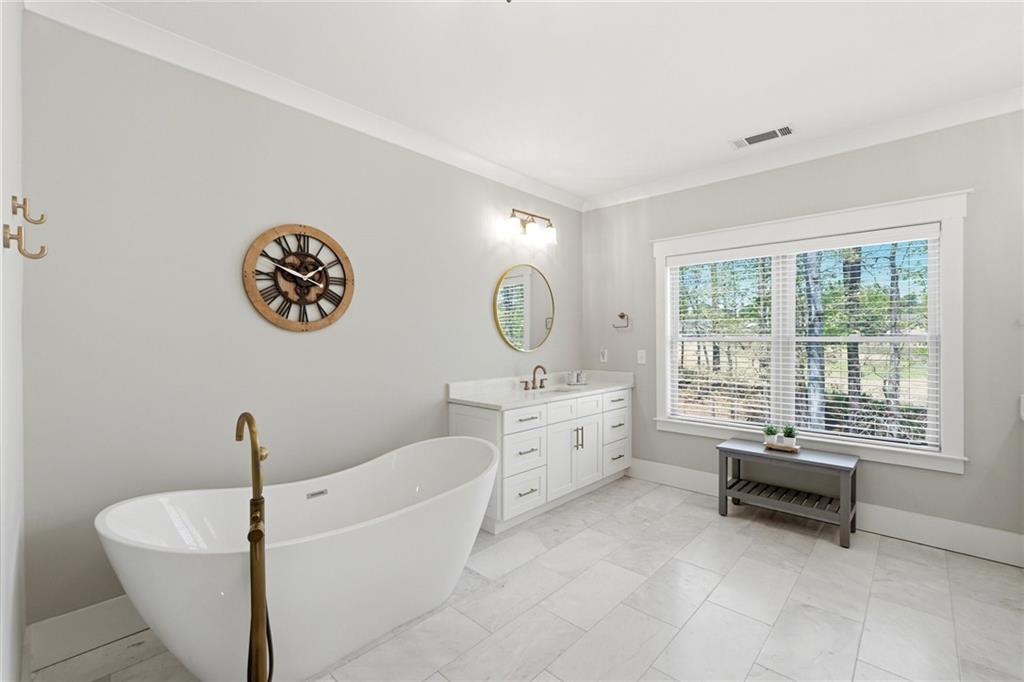 206 Trecastle Square Canton, GA 30114 - Photo 23 of 49 a living room with furniture and a large window