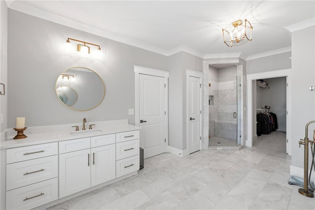 206 Trecastle Square Canton, GA 30114 - Photo 26 of 49 a spacious bathroom with a double vanity sink mirror and shower