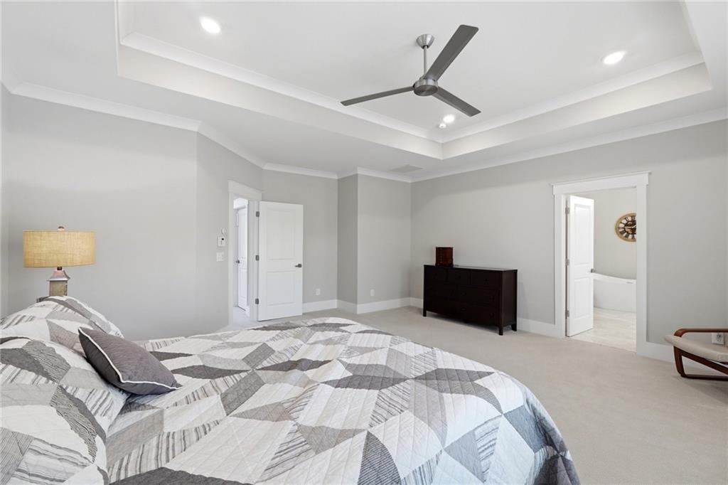 206 Trecastle Square Canton, GA 30114 - Photo 29 of 49 a bedroom with a bed and a lamp