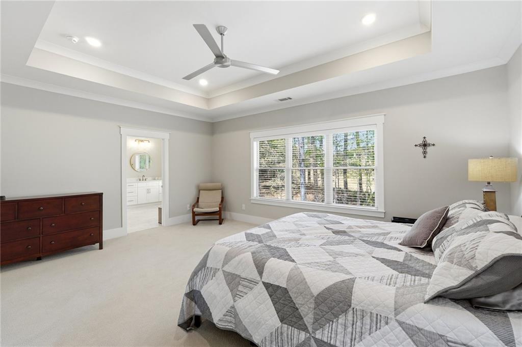 206 Trecastle Square Canton, GA 30114 - Photo 30 of 49 a spacious bedroom with a bed and a dresser
