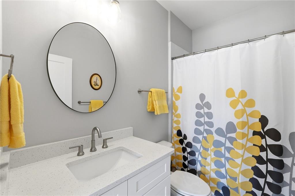 206 Trecastle Square Canton, GA 30114 - Photo 35 of 49 a bathroom with a sink mirror and toilet