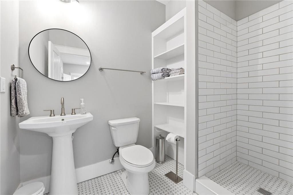 206 Trecastle Square Canton, GA 30114 - Photo 39 of 49 a bathroom with a toilet sink and a mirror