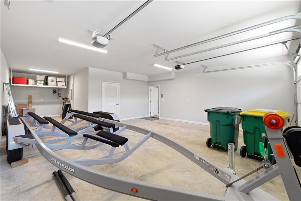 206 Trecastle Square Canton, GA 30114 - Photo 41 of 49 a room with gym equipment and a table