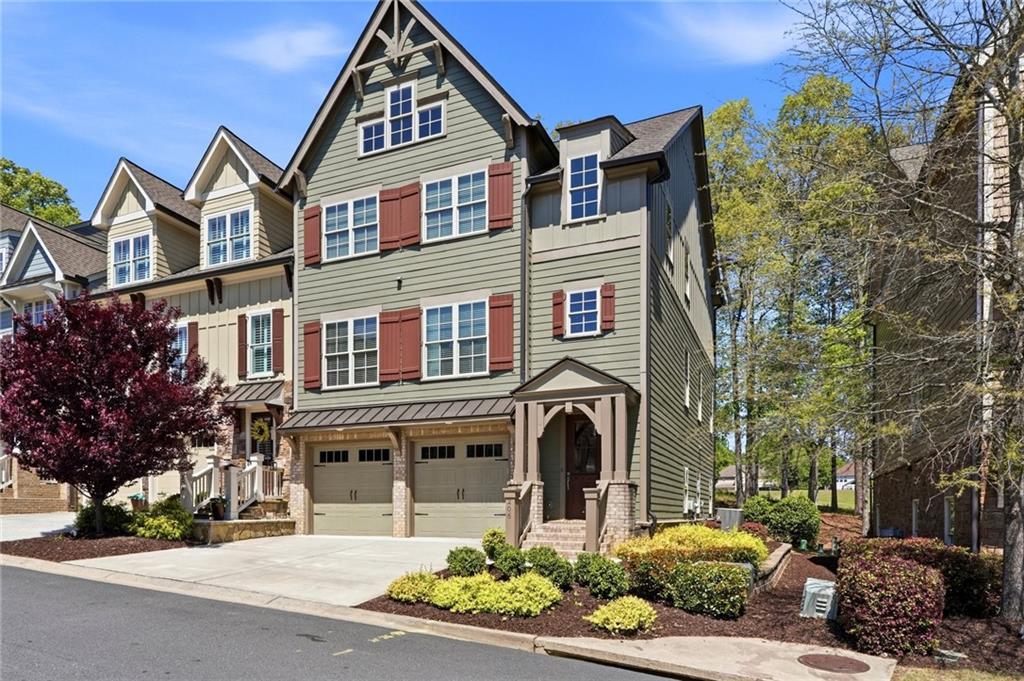 206 Trecastle Square Canton, GA 30114 - Photo 46 of 49 a front view of a residential apartment building with a yard