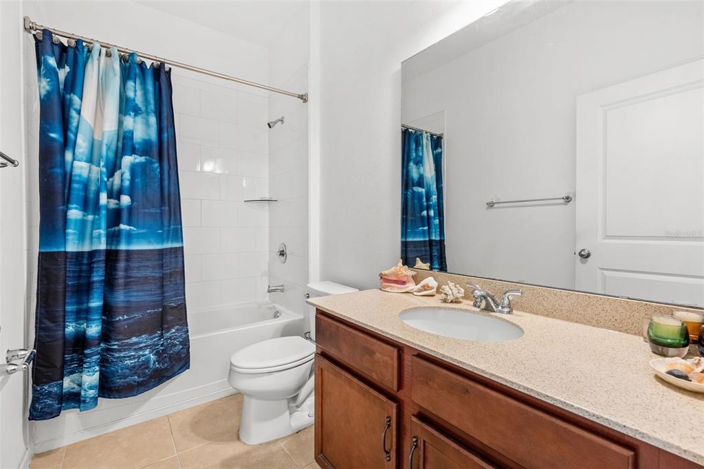2085 Lula Road Minneola, FL 34715 - Photo 10 of 39 a bathroom with a sink a toilet and shower