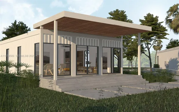 a view of a house with backyard porch and sitting area