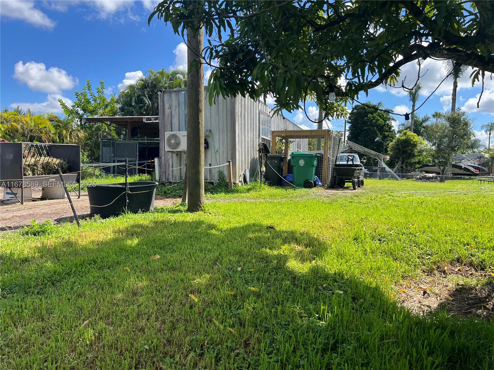 20321 Southwest 48th Street Southwest Ranches, FL 33332 - Photo 31 of 46 a view of a house with backyard and sitting area