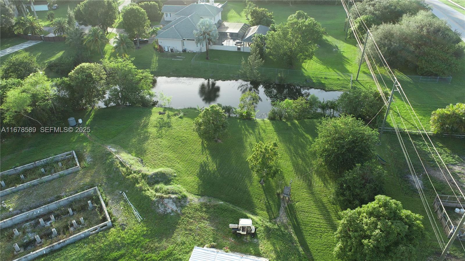 20321 Southwest 48th Street Southwest Ranches, FL 33332 - Photo 40 of 46 an aerial view of a residential houses with outdoor space and trees