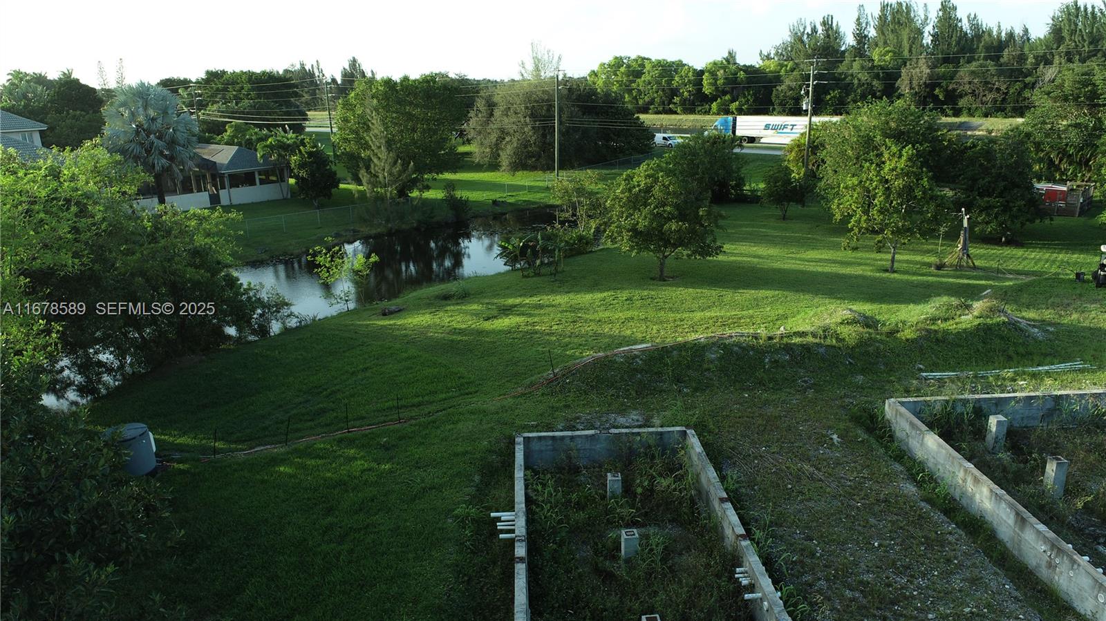 20321 Southwest 48th Street Southwest Ranches, FL 33332 - Photo 43 of 46 a view of a golf course with a lake