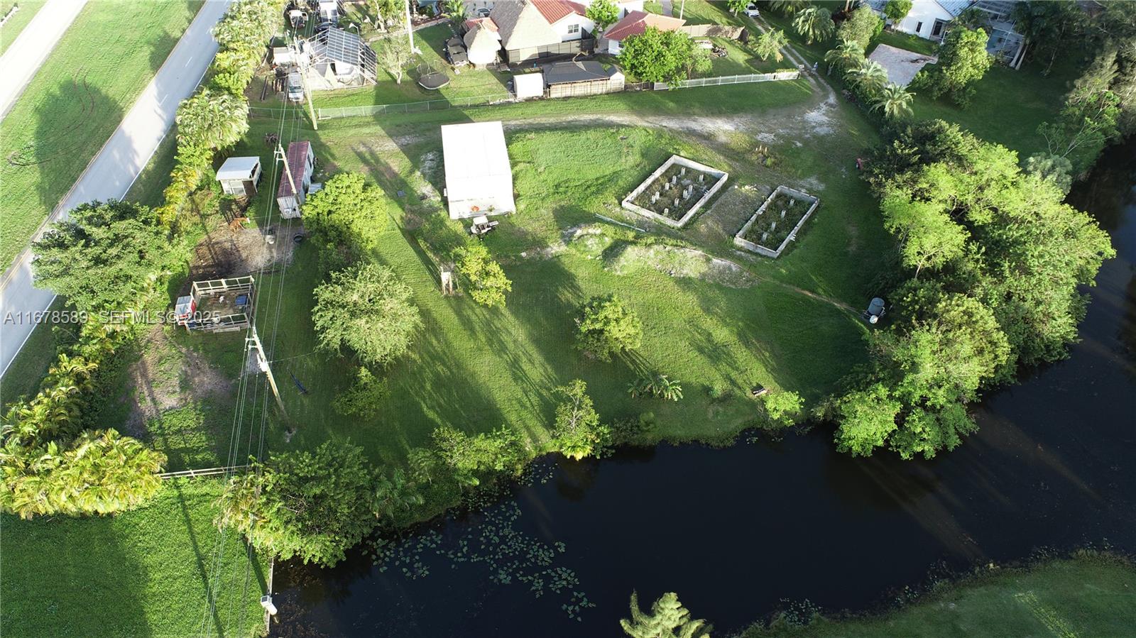 20321 Southwest 48th Street Southwest Ranches, FL 33332 - Photo 10 of 46 a view of a garden with a lake
