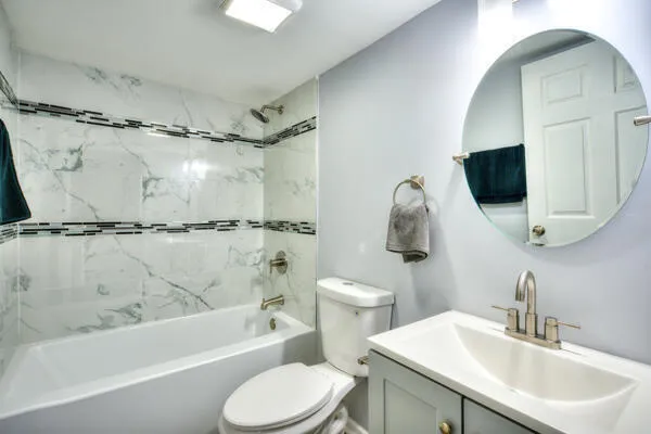 a bathroom with a sink toilet and shower