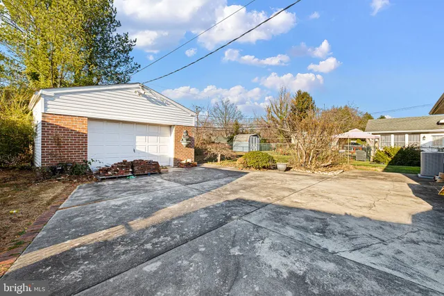 a view of a house with snow on the road