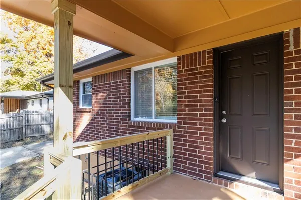 a view of wooden door with a yard