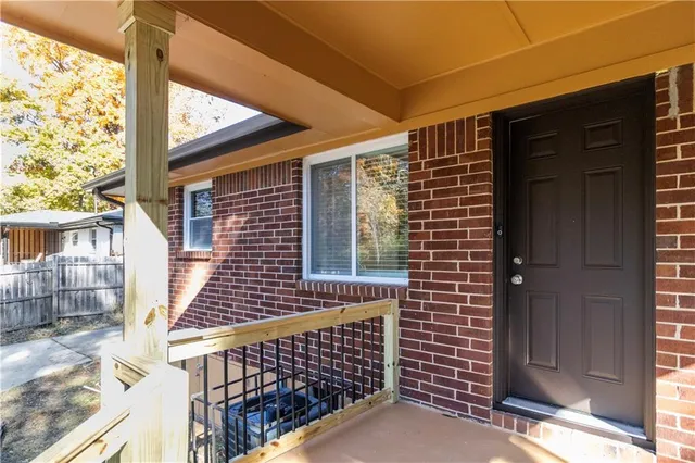 a view of wooden door with a yard