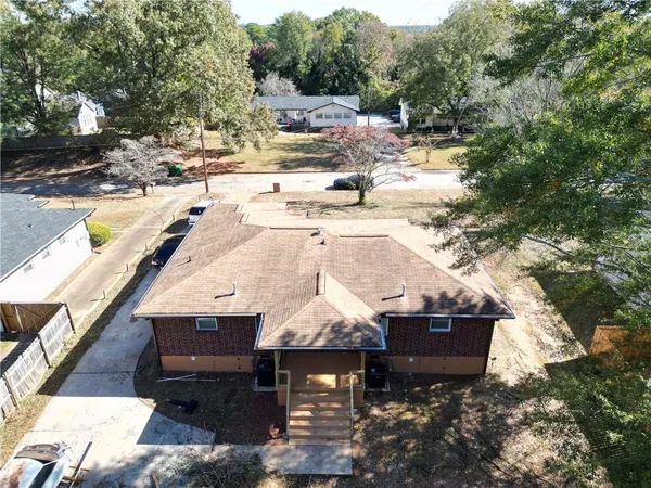 an aerial view of residential houses with outdoor space