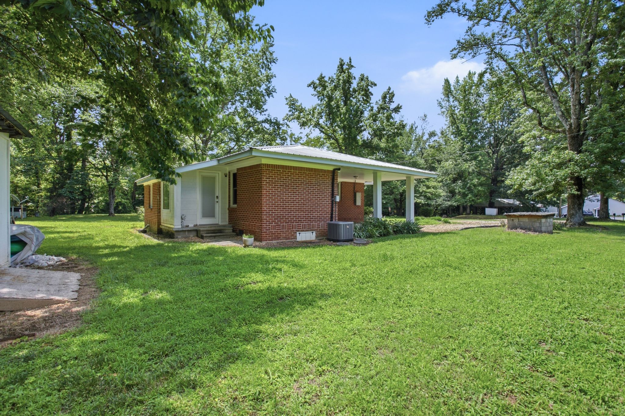 150 Toms Creek Road Linden, TN 37096 - Photo 20 of 23 a backyard of a house with lots of green space