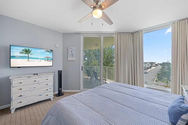 a bedroom with a bed and a flat tv screen