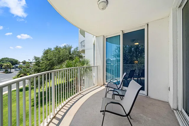 a view of a chair and table in the balcony