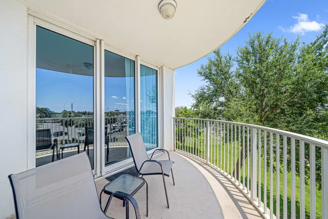 a view of two chairs in the balcony