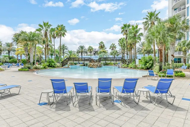 a lake view with tables and chairs